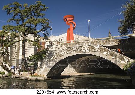 The Scenic River Walk. San Antonio's Number One Attraction - A Below Streetlevel Promenade Of Bars And Restaurants. In The Background Is The Torch Of Friendship, San Antonio, Texas, Usa View Large Photo Image Picture - The Scenic River Walk. San Antonio's Number One Attraction - A Below Streetlevel Promenade Of Bars And Restaurants. In The Background Is The Torch Of Friendship, San Antonio, Texas, Usa. Fotosearch