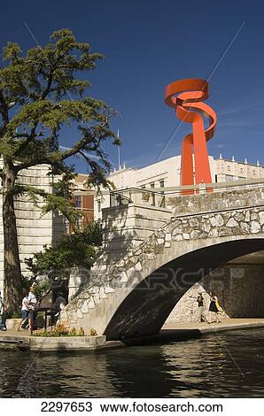 The Scenic River Walk. San Antonio's Number One Attraction - A Below Streetlevel Promenade Of Bars And Restaurants. In The Background Is The Torch Of Friendship, San Antonio, Texas, Usa View Large Photo Image Stock Image - The Scenic River Walk. San Antonio's Number One Attraction - A Below Streetlevel Promenade Of Bars And Restaurants. In The Background Is The Torch Of Friendship, San Antonio, Texas, Usa. Fotosearch