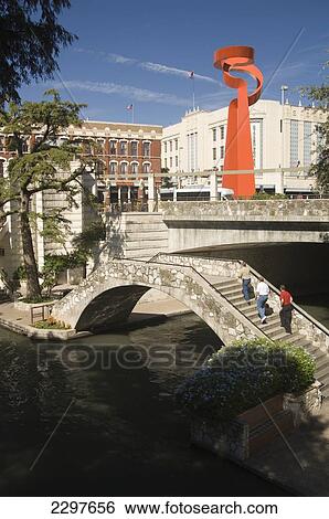 The Scenic River Walk. San Antonio's Number One Attraction - A Below Streetlevel Promenade Of Bars And Restaurants. In The Background Is The Torch Of Friendship, San Antonio, Texas, Usa View Large Photo Image Stock Photograph - The Scenic River Walk. San Antonio's Number One Attraction - A Below Streetlevel Promenade Of Bars And Restaurants. In The Background Is The Torch Of Friendship, San Antonio, Texas, Usa. Fotosearch