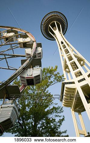 Stock Image - The Seattle Space Needle And Ferris Wheel; Seattle, Washington, United States Of America. Fotosearch