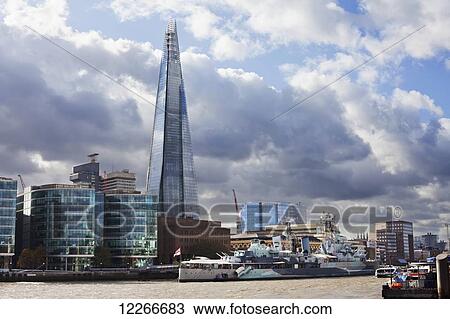 Stock Image - The Shard beyond the Thames; London, England. Fotosearch
