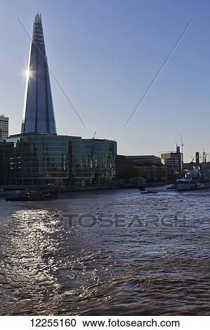 Stock Image - The Shard building next to the River Thames; London, England. Fotosearch