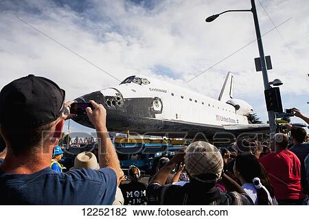 Stock Image - The Space Shuttle Endeavor is transported through the streets of downtown Los Angeles; Los Angeles, California, United States of America. Fotosearch