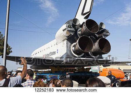 The Space Shuttle Endeavor is transported through the streets of downtown Los Angeles; Los Angeles, California, United States of America View Large Photo Image Stock Image - The Space Shuttle Endeavor is transported through the streets of downtown Los Angeles; Los Angeles, California, United States of America. Fotosearch