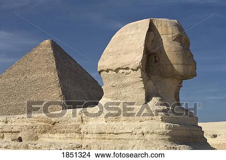 Picture - The Sphinx With The Pyramid In Background. Fotosearch