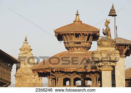 Stock Photograph - The Statue of King Bhupatindra Malla in worship in Bhaktapur's royal Durbar Square; Bhaktapur, Nepal. Fotosearch