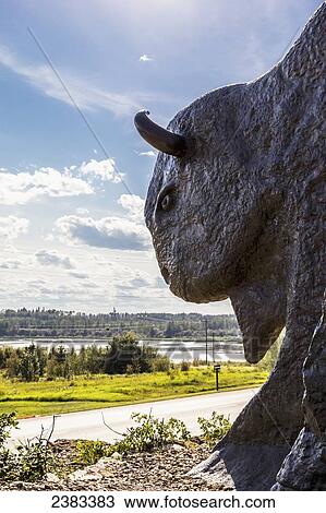 The Syncrude wood bison statue and entrance to gateway reclamation park in Fort McMurray's oil sands region; Fort McMurray, Alberta, Canada View Large Photo Image Stock Image - The Syncrude wood bison statue and entrance to gateway reclamation park in Fort McMurray's oil sands region; Fort McMurray, Alberta, Canada. Fotosearch