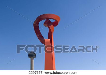 Stock Photo - The Torch Of Friendship With The Tower Of The Americas Behind, San Antonio, Texas, Usa. Fotosearch
