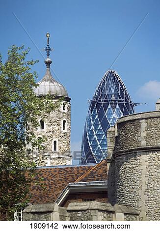 Stock Image - The Tower Of London With The Swiss Re Building Behind, London, Uk.. Fotosearch