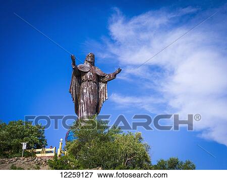 Stock Photo - The towering statue of Jesus Christ overlooks Cape Fatucama; Timor-Leste. Fotosearch