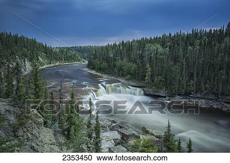 Stock Image - The Trout River Flows Over Coral Falls; Northwest Territories, Canada. Fotosearch