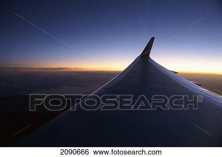 The View Over The Wing, From The Porthole Of A Charter Flight Above The Alps View Large Photo Image Stock Photograph - The View Over The Wing, From The Porthole Of A Charter Flight Above The Alps. Fotosearch