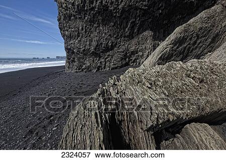 The volcanic beach around the town of Vik which is along the south coast of Iceland; Vik, Iceland View Large Photo Image Stock Photo - The volcanic beach around the town of Vik which is along the south coast of Iceland; Vik, Iceland. Fotosearch