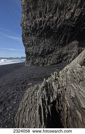 The volcanic beach around the town of Vik which is along the south coast of Iceland; Vik, Iceland View Large Photo Image Stock Photo - The volcanic beach around the town of Vik which is along the south coast of Iceland; Vik, Iceland. Fotosearch