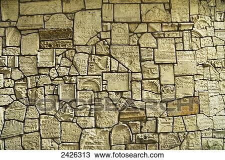 Stock Image - The Wailing Wall in Remuh Cemetery and Synagogue, also known as the Old Cemetery, Kazimierz; Krakow, Poland. Fotosearch