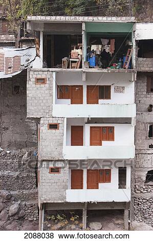 Stock Photo - The Wall Of This Building Along A Ravine Fell Off After The 8 October 2005 Earthquake, Hatian, Azad Kashmir, Pakistan. Fotosearch