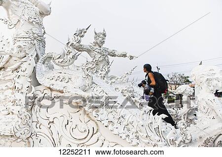Stock Image - The Wat Rong Khun temple, or White Temple; Chaing Rai, Thailand. Fotosearch