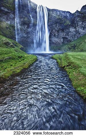Stock Photograph - The waterfall Seljalandsfoss along the southern coast; Iceland. Fotosearch