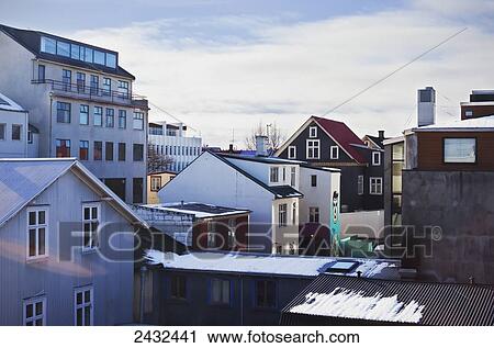 Stock Image - The window view from a hostel overlooking other buildings in downtown Reykjavik; Reykjavik, Iceland. Fotosearch