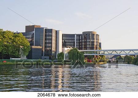 Stock Photo - The Winston Churchill Building Of The European Parliament On The Banks Of The Ill River, Strasbourg, France. Fotosearch