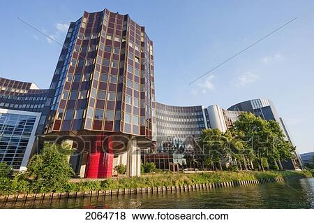 Stock Photo - The Winston Churchill Building Of The European Parliament On The Banks Of The Ill River, Strasbourg, France. Fotosearch