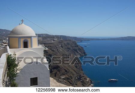 Stock Photo - The yellow domed Catholic church of St. John the Baptist; Fira, Santorini, Cyclades, Greek Islands, Greece. Fotosearch