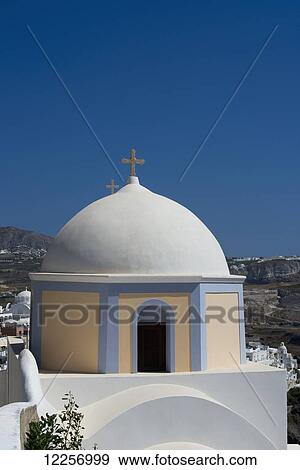 Stock Photo - The yellow domed Catholic church of St. John the Baptist; Fira, Santorini, Cyclades, Greek Islands, Greece. Fotosearch