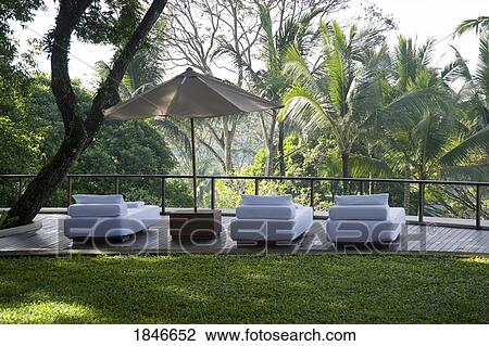 Stock Image - Three Beds On Terrace. Fotosearch