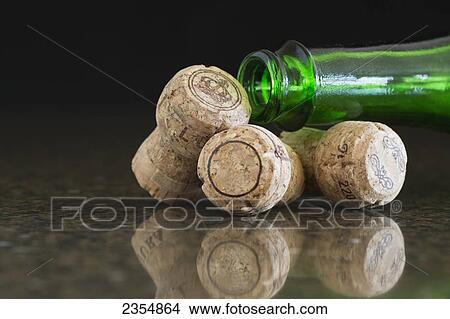 Picture - Three Corks And The Neck Of A Green Glass Bottle; Alberta, Canada. Fotosearch