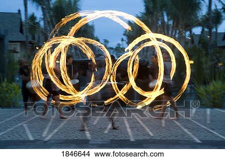 Picture - Three Fire-Twirlers Performing; Bali, Indonesia. Fotosearch
