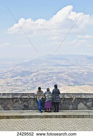 Stock Image - Three generations of women viewing the mexican landscape; Silao, Guanajuato, Mexico. Fotosearch