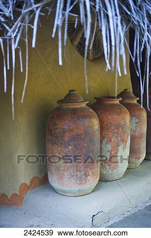Three jars on a step against a wall; Ulpotha, Embogama, Sri Lanka View Large Photo Image Stock Photo - Three jars on a step against a wall; Ulpotha, Embogama, Sri Lanka. Fotosearch