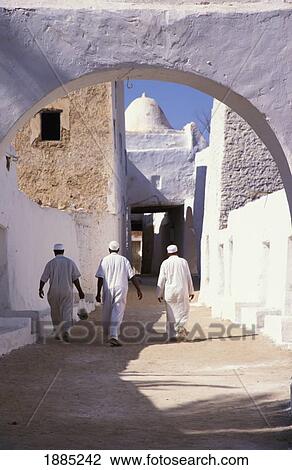 Three Men In Traditional Dress Walking In Old City View Large Photo Image Stock Image - Three Men In Traditional Dress Walking In Old City. Fotosearch