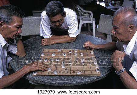 Three Senior Men Playing Traditional Board Game View Large Photo Image Stock Image - Three Senior Men Playing Traditional Board Game. Fotosearch