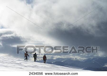 Three walkers on snowy, winter walk ascending Geal Charn, near Laggan; Scotland View Large Photo Image Stock Photograph - Three walkers on snowy, winter walk ascending Geal Charn, near Laggan; Scotland. Fotosearch