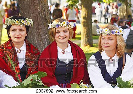 Stock Image - Three Women Dressed For Midsummer's Eve Festival; Jurmala Latvia. Fotosearch