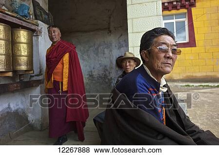 Stock Photo - Tibetan men at a temple; Garze, Sichuan, China. Fotosearch