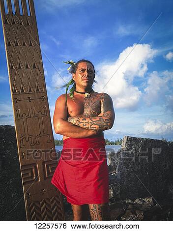 Tihoti, a tahitian Tattooist standing on sacred site; Tahiti View Large Photo Image Stock Photograph - Tihoti, a tahitian Tattooist standing on sacred site; Tahiti. Fotosearch