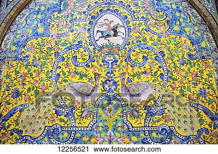 Stock Image - Tilework of hunting scene and peacocks, Golestan Palace; Tehran, Iran. Fotosearch