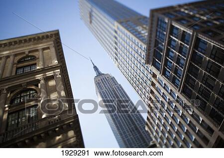 Stock Image - Tilt shift lens image - looking up at Sykscrapers in Manhattan, New York. USA.. Fotosearch