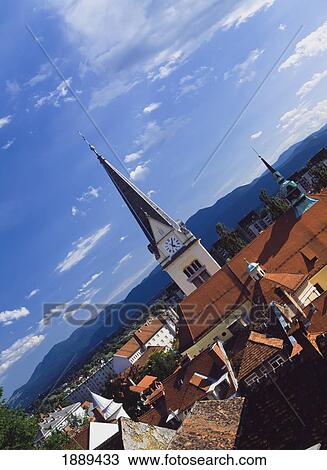 Tilted Angle View Of Church Spire And Roof Tops. View Large Photo Image Stock Image - Tilted Angle View Of Church Spire And Roof Tops.. Fotosearch