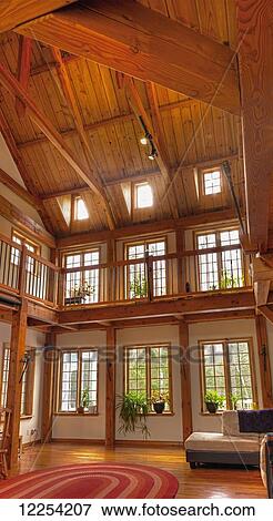 Stock Photo - Timber frame log home at Hummingbird Retreat Centre; St. Etienne de Bolton, Quebec, Canada. Fotosearch