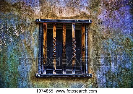 Stock Photography - Time Fades Away, New Mexico, Rustic Colorful Details In Barred Window And Adobe Wall.. Fotosearch