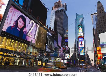 Times Square neon lights and traffic, Manhattan; New York City, New York, United States of America View Large Photo Image Stock Image - Times Square neon lights and traffic, Manhattan; New York City, New York, United States of America. Fotosearch