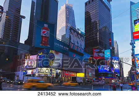 Stock Image - Times Square neon lights and traffic, Manhattan; New York City, New York, United States of America. Fotosearch