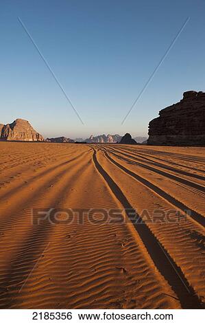 Stock Photograph - Tire Tracks In The Early Morning, Wadi Rum, Jordan, Middle East. Fotosearch