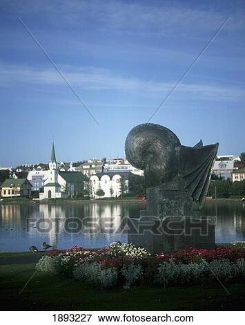 Stock Photo - Tjornin (Pond) And Modern Statue, Old Town In Background. Fotosearch