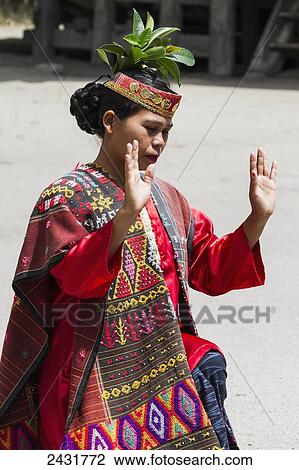 Toba Batak woman performing a traditional Batak dance at Huta Bolon Museum in Simanindo village on Samosir Island, Lake Toba, North Sumatra, Indonesia View Large Photo Image Stock Image - Toba Batak woman performing a traditional Batak dance at Huta Bolon Museum in Simanindo village on Samosir Island, Lake Toba, North Sumatra, Indonesia. Fotosearch
