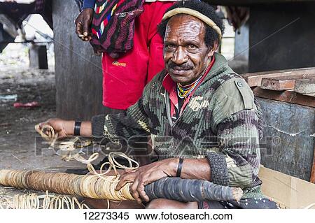 Tobacco vendor at the market, Wamena, Papua, Indonesia View Large Photo Image Stock Photography - Tobacco vendor at the market, Wamena, Papua, Indonesia. Fotosearch