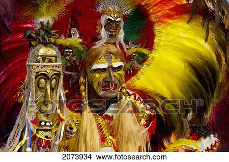 Picture - Tobas Dancer Wearing An Elaborate Mask, Feather Headdress And Costume In The Procession Of The Carnaval De Oruro, Oruro, Bolivia. Fotosearch
